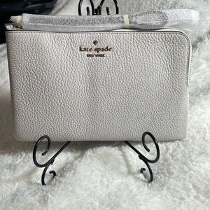 Brand new Kate Spade quill grey wristlet